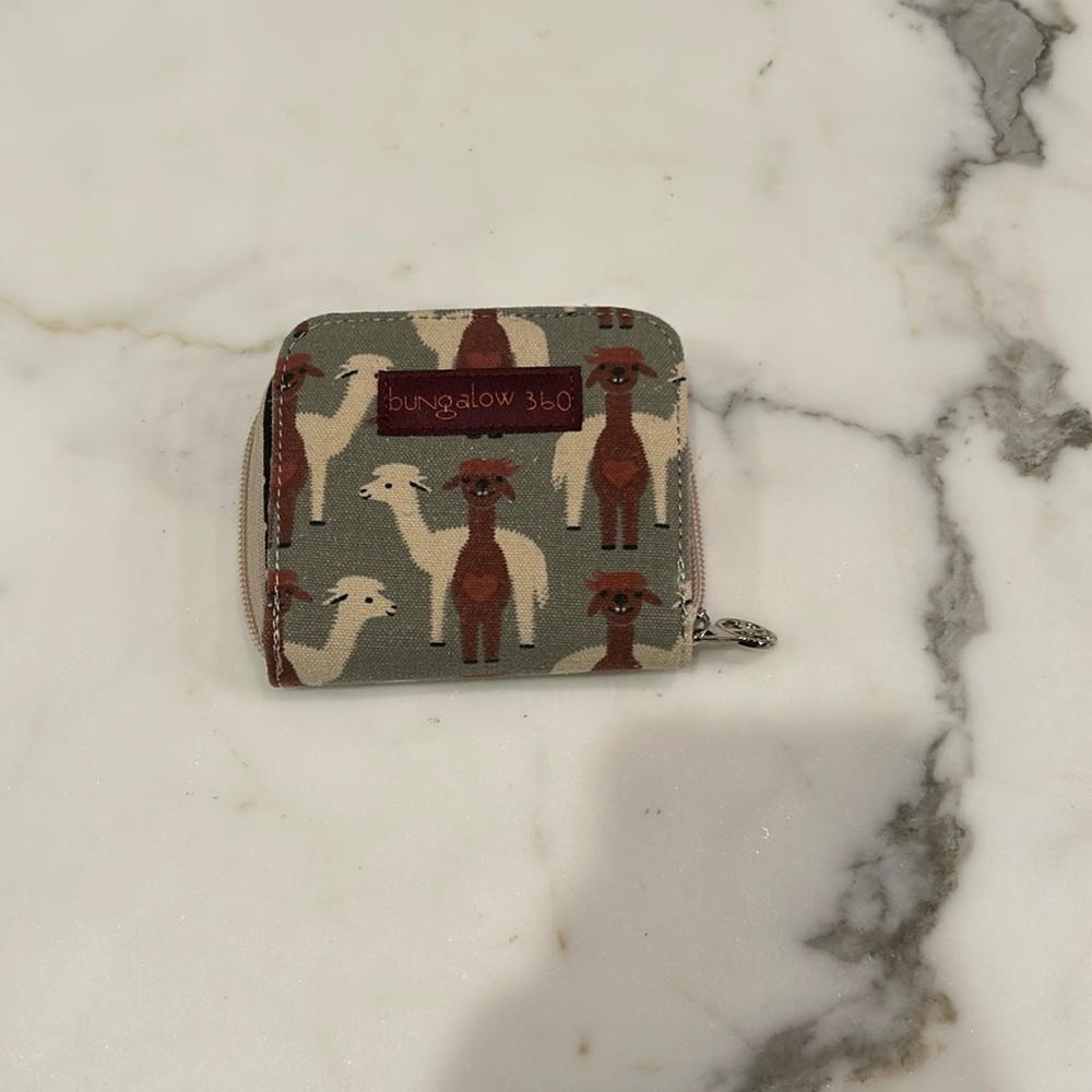 This wallet is an excellent preowned condition and barely used.